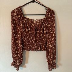 Size Small Flower Print Never Worn Perfect Condition Brown Printed Tops For Spring, Casual Brown Floral Print Tops, Brown Floral Print Blouse For Day Out, Brown Floral Print Long Sleeve Tops, Brown Long Sleeve Floral Print Tops, Brown Floral Print Top For Brunch, Fitted Brown Floral Print Blouse, Fitted Brown Blouse With Floral Print, Brown Floral Print Long Sleeve Blouse