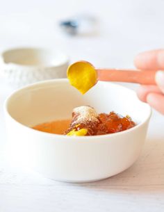 a person is spooning food out of a bowl