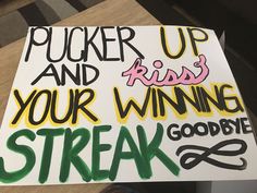 a sign that says pucker up and kiss your winning streak good bye on it