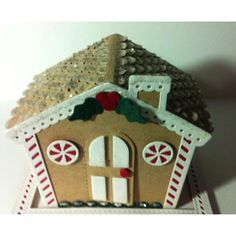 a gingerbread house is decorated with candy canes