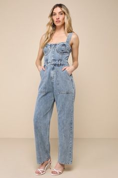 This spring will be full of admirers and compliments with a trendy look like the Lulus Fresh Perfection Light Wash Bustier Sleeveless Denim Jumpsuit! Slightly acid-washed 100% cotton denim shapes this too-cool jumpsuit that features a bustier-inspired bodice with seamed cups and a sweetheart neckline, supported by wide adjustable tank straps. A hidden snap button placket secures the front of the bodice, atop a banded waist with convenient belt loops and a hidden zip fly. The relaxed, straight pa Jumpsuit Denim, Black Strapless Jumpsuit, Denim Bustier, Lulu Pants, Chiffon Jumpsuit, Jumpsuit Blue, Two Piece Jumpsuit, Backless Jumpsuit, Floral Print Rompers