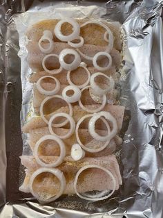 the food is prepared and ready to be cooked in the oven on the foil lined baking sheet