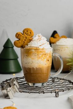 two glasses filled with hot chocolate and marshmallows