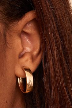 The One Midi Oval Hoops are easy to love. With a sleek design, these hoops will add polished shine to any ear stack or stand out solo as your go-to statement earrings. Metal: 14k Yellow Gold Dimensions: 6mm Tube, 20mm Inner Length Diameter Weight: 2.1 Grams Origin: Crafted in Arezzo, Italy Arezzo Italy, Ear Stack, Earrings Metal, Easy To Love, Yellow Color, Sleek Design, Statement Earrings, The One, Hoop Earrings