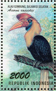 a stamp with a bird sitting on top of a tree branch in front of a blue sky