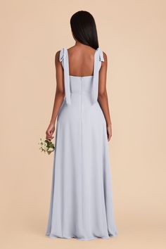 the back of a bridesmaid's dress in light blue