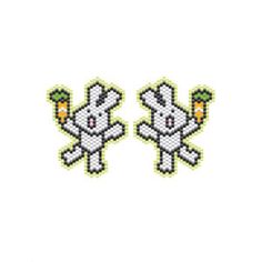 two cross stitched rabbits with carrots on their heads, one is white and the other is green