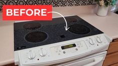 a white stove top oven sitting inside of a kitchen