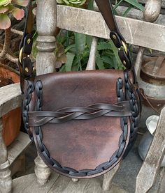 This bag was relaced with a beautiful rustic style leather lace....we did recondition and oil  the leather and replaced the old rivets... measurements of this leather bag are 9 inches tall, 10 inches across, gusset measures 2 inches, shoulder strap drop is 14 inches...this is a shoulder bag and not crossbody bag Brown Saddle Bag With Brass Hardware, Leather Satchel Saddle Bag For Festivals, Handmade Brown Saddle Bag, Bohemian Leather Saddle Bag With Leather Handles, Bohemian Leather Saddle Satchel Bag, Brown Crossbody Saddle Bag For Festival, Bohemian Leather Saddle Bag Satchel, Brown Satchel Saddle Bag For Festivals, Brown Leather Saddle Bag For Festival