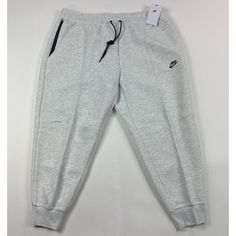 Nike Sportswear Tech Fleece Women's Heather Gray Jogger Style Sweatpants. - Msrp $115.00 - Style # Fb8332-013 - Standard Fit - Mid Rise - Full Length - Drawstring Elastic Waist - 2 Pockets On Waist With 1 Zipper Pocket - Jogger Cuffs Body- 53% Cotton / 47% Polyester Pockets- 100% Cotton Brand New Original Tags. Women's Size 2x Outseam Length- 37.5" 100% Genuine Us Seller & Family-Owned Business Fleece Tracksuit With Elastic Waistband In Sportswear Style, Fleece Sweats For Sports, Gray Sportswear Activewear For Leisure, Sportswear Fleece Bottoms For Leisure, Gray Sportswear For Leisure, Nike Sports Bottoms With Ribbed Cuffs, Casual Nike Tracksuit With Pockets, Fleece Sportswear Pants For Leisure, Fleece Pants For Leisure Sportswear