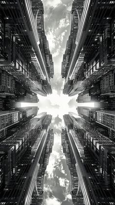 an abstract photo of buildings in the city with sky and clouds reflected on the ground