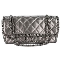 Chanel Chain Me Flap Bag in quilted matte gray metallic calfskin leather and matte gunmetal hardware details. Features a woven chain and the CC logo. Bag closes with magnetic button and has a sliding chain strap for shoulder or crossbody wear. Comes with original dustcover. Handle drop 9.5". First two numbers 14. Platinum Chain, Chanel Chain, Woven Chain, Cc Logo, Flap Bag, Fashion Handbags, Chain Strap, Evening Bags, Calf Skin