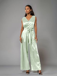 This soft satin jumpsuit features a flattering v-neck design, making it the perfect choice for mothers of the bride. Its dress pantsuit style provides comfort and elegance, while its high-quality material ensures a polished look. Stay stylish and comfortable on that special day with our jumpsuit. Dress Pantsuit, Jumpsuit Design, Elegant Jumpsuit, Satin Jumpsuit, Confident Style, Designer Jumpsuits, Jumpsuit Elegant, Mother Of The Bride Dress, Mother Of The Bride Dresses