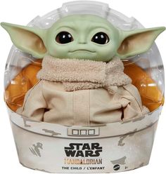 the child yoda toy is in a plastic container