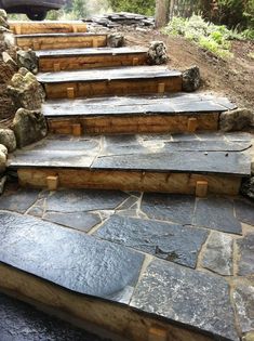 stone steps leading up to the top of a hill