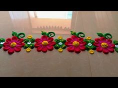 decorative wall hangings with flowers on them