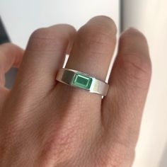 Item Details: One 7x5mm natural emerald cut emerald. This ring is 6 mm wide at the top and 3.5 mm wide at the base. Please note, we can set antique/heirloom diamonds in this setting. Set in your choice of platinum or 14K white, yellow, or rose gold. Please allow 10 days for production & delivery. Anniversary Emerald Ring With Bezel Setting, Modern Emerald Cut Emerald Signet Ring, Fine Jewelry Emerald Cut Emerald Ring With Polished Finish, Emerald Cut Fine Jewelry Emerald Ring With Polished Finish, Modern Green Emerald Cut Signet Ring, Formal Emerald Cut Emerald Ring With Tension Setting, Minimalist Emerald Cut Emerald Ring For May, Emerald Cut Signet Ring With May Birthstone For Anniversary, Emerald Cut Signet Ring For Anniversary With May Birthstone