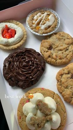 an assortment of cookies and pastries in a box