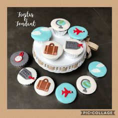 there are cupcakes with travel themed decorations on the top and bottom one is blue