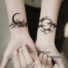 two people holding hands with tattoos on their wrist