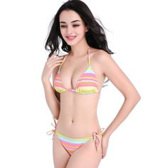 Get ready to make a bold fashion statement at the beach or poolside with our stunning 2023 New Rainbow Striped Lace-up Nylon Bikini Swimsuit. This eye-catching two-piece swimsuit features vibrant rainbow stripes that will instantly elevate your summer style. The unique lace-up design adds a touch of trendy flair, ensuring you stand out from the crowd. Made from high-quality nylon fabric, this bikini offers a comfortable and flattering fit, allowing you to move with ease while enjoying your time Multicolor Tie-side Swimwear For Summer, Multicolor Beach Party Swimwear, Multicolor Beachwear For Beach Party, Multicolor Swimwear For Poolside, Multicolor Poolside Swimwear For Beachwear, Poolside Swimwear With Lined Body And Tie-side Bottom, Multicolor Swimwear For Beach Season, Multicolor Swimwear For Beach Season Swimming, Yellow Lined Swimwear For Sunbathing