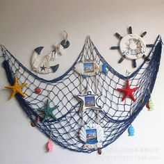 there is a wall hanging made out of various items on the wall, including a net