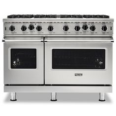 a stainless steel stove with four burners and two oven doors on each side, in front of a white background