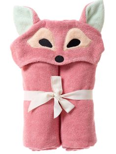 a pink towel with a fox face on it and a bow around the neck,