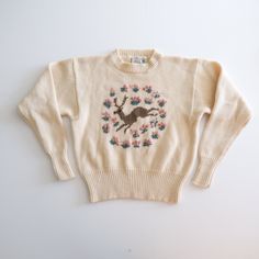 "Gorgeous chunky knit vintage sweater by classic brand JG Hook! Beautiful thick winter white/cream wool.  Brown knit deer with pink flower rosettes.  Crew neck style with sightly cropped shape.  Cute anchor label.  Brand: JG Hook Tag size: Large (runs smaller) Approximate measurements:  21\" from armpit to armpit 22\" long 24\" sleeve length (from underarm to cuf) Condition: EXCELLENT vintage" Vintage Beige Chunky Knit Sweater, Vintage Cream Sweater With Fair Isle Pattern, Swan Sweater, Deer Sweater, Vintage Sweater, Pullover Sweater Women, Chunky Sweater, Winter White, Vintage Sweaters