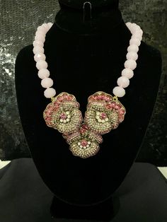 "Heidi Daus Pleasing Pansy Beaded Crystal Drop Necklace Pink Version Cultivate your style. This beautiful wildflower design adds a sweet, feminine touch to your favorite looks. Pretty pink crystals give it an appeal that compliment any color Necklace Measurements: Approx. 18-1/2\"L x 1/2\"W with 3-1/2\" extender Drop Measurements: Approx. 3\"L x 3-3/8\"W Design Information This piece contains Sapphire, light sapphire, light topaz and Air blue opal colored crystals  A single strand of individuall Jeweled Beaded Necklaces For Party, Pink Crystal Beaded Necklaces, Pink Beaded Crystal Jewelry, Beaded Rhinestone Necklace For Gift, Jeweled Crystal Beaded Costume Necklace, Embellished Crystal Necklaces For Gift, Crystal Beaded Chain Necklace, Crystal Beaded Costume Jewelry Necklace, Pink Crystal Beaded Necklaces For Party