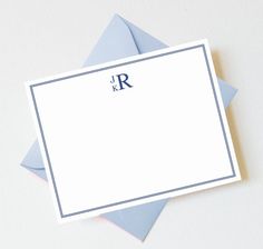 two folded cards with the letter r on them, one in blue and one in white