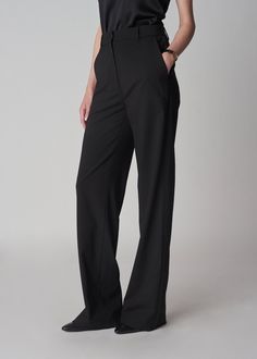 High-waisted flat-front trousers with silk satin trim along the side seams. Straight silhouette with a subtle elongating flare at the hem. We recommend leaving the hem long. Details 95% Virgin Wool 5% Elastane, Trim: 100% Silk Black 5322ABSW-CORE True to size Inseam 33" Model is 5'11", has a 23" waist, wears a size 4. Tuxedo Pants, Tuxedo Blazer, Silk Knit, Trim Detail, Welt Pockets, Silk Satin, Welt Pocket, Wool Blend, Size 2