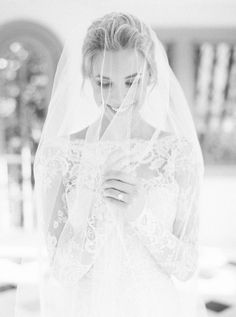 a woman in a wedding dress and veil