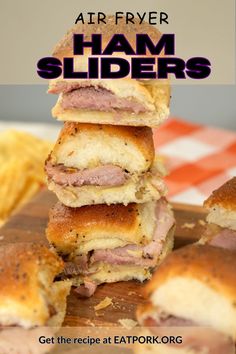 ham sliders stacked on top of each other with text overlay reading air fryer ham sliders