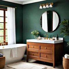 a bathroom with green walls and a white bathtub next to a large round mirror