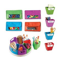 several different colored bins with pens, scissors and pencils in them on a white background