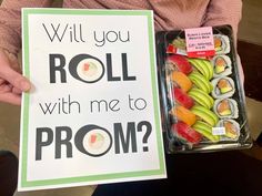 a person holding up a sign that says will you roll with me to prom?