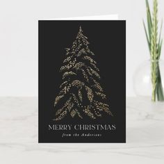 a black and gold christmas card with a tree on it