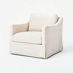 a white chair sitting on top of a white floor