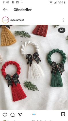 four different types of hair ties on top of a white sheet with pine needles and bows