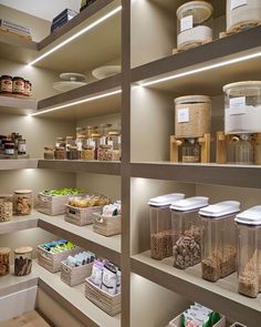 an organized pantry with lots of food and containers on the shelves, including cereals