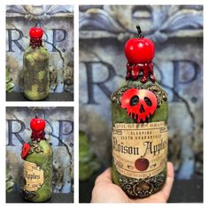 a bottle with a red apple on top and an image of a skull in it