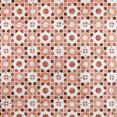 an orange and white tiled wall with hearts on it