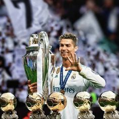 the soccer player is posing with his trophies