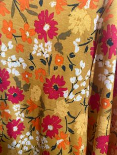 an orange and red floral print fabric