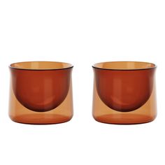 two brown glass cups sitting next to each other