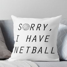 a throw pillow that says sorry i have net ball on the front and back of it