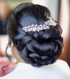 the back of a woman's head wearing a hair comb