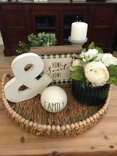 there is a basket with flowers in it and a sign that says 8 and an egg