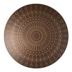 a brown and gold plate with circles on it